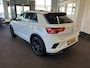 Volkswagen T-Roc 2.0 TSI 4Motion R 300PK | Panoramadak | Digital dashboard | Beats audio | Adaptieve cruise control | Adaptief onderstel | Lane assist | Dodehoeksdetectie | Achteruitrijcamera | Stoelverwarming | Kleppensysteem | Elek. inklapbare spiegels