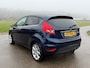 Ford Fiesta 1.25 Titanium / Leder / Stoelverwarming / Clima / 15" Velgen / Trekhaak / PDC / Cruise / A-Z onderhouden /