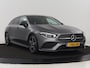 Mercedes-Benz CLA 180d Business Solution AMG | Stoelverwarming | Carplay | Camera | Leder/Alcantara | Navigatie | Widescreen | Sfeerverlichting | Designo Mountaingrijs Magno