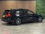 Volvo V60 T6 AWD Recharge Ultra Dark | Trekhaak | Schuifdak | Head-Up Display | Harman Kardon | Adaptieve Cruise Control | Stoelverwarming voor+achter | Stuurwielverwarming | Full LED Meesturende koplampen | Parkeercamera | Pilot Assist | BLIS Dode Hoek Detectie | Elektrische voorstoelen geheugen | Lederen bekleding | Zitting verlenging voorstoelen | Lederen dashboard | 18 Inch | Google Infotainment | Keyless Drive | Parkeersensoren voor+achter | Privacy Glass | Elektrisch bedienbare achterklep | DAB Radio | Apple Carplay/Android Auto | Volvo On Call met mobiele App functie | Onyx Black Metallic |