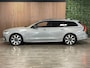 Volvo V90 T8 AWD Recharge Ultra Ultimate Dark | Schuifdak | Trekhaak | 455pk | Head-Up Display | Harman Kardon | Adaptieve Cruise Control | Stoel en Stuurwielverwarming | Parkeercamera | Full LED Meesturende koplampen | Pilot Assist | BLIS Dode Hoek Detectie | Google Infotainment | 19 Inch | Elektrische voorstoelen geheugen | Lederen bekleding | Zitting verlenging voorstoelen | Lederen Dashboard | Keyless Drive | Geïntegreerde kinderzitjes achterin | Geïntegreerde zongordijnen achterportieren | Parkeersensoren voor+achter | Privacy Glass | Elektrisch bedienbare achterklep | DAB Radio | Apple Carplay/Android Auto | Volvo On Call met mobiele App functie | Vapour Grey Metallic |