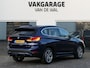 BMW X1 sDrive18i High Executive | Orange edition | Trekhaak | Achteruitrijcamera | Sport stoelen | LED | Elektrische achterklep | Stoelverwarming | Climate Control