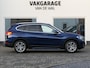 BMW X1 sDrive18i High Executive | Orange edition | Trekhaak | Achteruitrijcamera | Sport stoelen | LED | Elektrische achterklep | Stoelverwarming | Climate Control