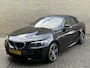 BMW 2-Serie Cabrio 218i High Executive M-pakket | Leder | Camera | Navigatie | Apple CarPlay / Android Auto | 18 inch LMV | Sportstoelen | Sportstuur | LED | DAB | Windscherm | Stoelverwarming | Volledig onderhouden | Origineel NL-auto met NAP!