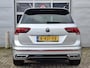 Volkswagen Tiguan 1.5 TSI R-Line | Navigatie/Android/Apple Carplay | LM Velgen 19" | Elektrisch Glazen Panoramadak | Voorstoelen Verwarmd | Cruise Control Adaptief | Achteruitrijcamera | Airco |