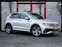Volkswagen Tiguan 1.5 TSI R-Line Business+ | IQ Light | Navigatie | Camera | Matrix LED | Adaptieve Cruise Control | Navigatie | Virtual Cockpit | Apple Carplay | Android Auto | Metallic Lak | 3x R-Line | 19'' Lichtmetalen Velgen |