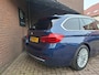 BMW 3-Serie Touring 318i Luxury Edition Apple Carplay / Harman & Kardon / Stoelverwarming / Led Verlichting / DAB Radio