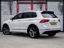 Volkswagen Tiguan 1.5 TSI R-Line | Trekhaak | LED Koplampen | Adaptieve Cruise Control | Parkeersensoren | Climate Control | Apple Carplay | Android Auto | Privacy Glas | Keyless Entry & GO | Flippers | Variabele Stuuroverbrenging | 19'' Lichtmetalen Velgen |