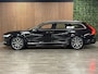Volvo V90 T4 Aut. Inscription Luxury | Trekhaak | Schuifdak | Stoelventilatie | Head-Up Display | Stoelmassage | Standkachel met Volvo On Call App | Adaptieve Cruise Control | Stoelverwarming voor+achter | Stuurwielverwarming | Pilot Assist | BLIS Dode Hoek Detectie | Parkeercamera | Elektrische voorstoelen geheugen | Nappa lederen bekleding | Zitting verlenging voorstoelen | Lederen dashboard | 4-Spaaks sport stuurwiel | 19 Inch | Keyless Drive | Parkeersensoren voor+achter | Elektrisch bedienbare achterklep | Geintegreerde zongordijnen achterportieren | Verlichte instaplijsten | 4-Zone Climate Control | Apple Carplay/Android Auto | Onyx Black Metallic |
