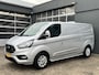 Ford Transit Custom 300 2.0 TDCI L2H1 Limited Airco Cruise control Trekhaak 2800kg trekgewicht 3-Persoons Stoelverwarming Telefoonverbinding Achterruitrij camera Parkeersensoren voor en achter Schuifdeur Euro 6