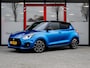 Suzuki Swift 1.4 Sport Smart Hybrid | 140PK | Carbon | Two-Tone Kleur | Navigatie | Camera | Apple Carplay | Android Auto | Climate Control | Adaptieve Cruise Control | 17'' Lichtmetalen Velgen | LED | Metallic Lak | Sportstoelen |