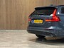 Volvo V60 T6 AWD Recharge Ultra Dark | Trekhaak | Schuifdak | Head-Up Display | Harman Kardon | Adaptieve Cruise Control | Stoelverwarming voor+achter | Stuurwielverwarming | Full LED Meesturende koplampen | Parkeercamera | Pilot Assist | BLIS Dode Hoek Detectie | Elektrische voorstoelen geheugen | Lederen bekleding | Zitting verlenging voorstoelen | Lederen dashboard | 18 Inch | Google Infotainment | Keyless Drive | Parkeersensoren voor+achter | Privacy Glass | Elektrisch bedienbare achterklep | DAB Radio | Apple Carplay/Android Auto | Volvo On Call met mobiele App functie | Denim Blue Metallic |