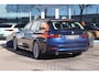 BMW 3-Serie Touring (g21) 320e 204pk I HiFi I Navi I Carplay I Stoelverwarming I LED I Cruise I Tansanitblau