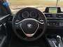 BMW 1-Serie 118i Sport Line Aut.| Leder | PDC Voor & Achter | Stoelverw. | Trekhaak | CC | 17"LMV