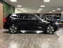 Volvo XC60 T6 AWD Recharge Plus Brigth | MY26 Facelift | Trekhaak | 360° Camera | Harman Kardon | Adaptieve Cruise Control | Stoelverwarming voor+achter | Stuurwielverwarming | Pilot Assist | BLIS Dode Hoek Detectie | Elektrische voorstoelen geheugen | Nordico Quilted bekleding | Zitting verlenging voorstoelen | Google Infotainment | 19 Inch | Keyless Drive | Parkeersensoren voor+achter | Privacy Glass | Elektrisch bedienbare achterklep | DAB Radio | Apple Carplay/Android Auto | Draadloos telefoon opladen | Volvo On Call met mobiele App functie | Onyx Black Metallic |