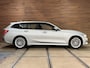 BMW 3-Serie Touring 320e Sportline | Pano | Leder | Laser | Shadow Line | Trekhaak elektr. | 18 inch | Stoelverwarming