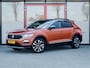 Volkswagen T-Roc 1.5 TSI Sport | Trekhaak | Beats Premium Audio | Stoelverwarming | Dode Hoek Detectie | Virtual Cockpit | Adaptieve Cruise Control | Climate Control | Camera | Parkeer Assist | Flippers | Two-Tone Metallic |