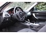 BMW 1-Serie 116i Business+ | Automaat | Navi | Xenon | Stoelverwarming | Leer