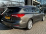 Ford Focus Wagon 1.0 125PK Titanium X | B&O SOUND| STUUR, STOEL EN VOORRUITVERWARMING| CAMERA| LED KOPLAMPEN| KEYLESS ENTRY/START| NAVIGATIE + APPLE CARPLAY/ANDROID AUTO|