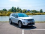 Land Rover Discovery Sport P300e 1.5 R-Dynamic SE | Adapt. Cruise | Stoelverwarming | Blackpack | Facelift | Panorama dak | 360° camera |