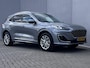 Ford Kuga 2.5 PHEV Vignale Automaat / 1.500 kg trekgewicht / Leder / Adaptieve CC / Dode hoek detectie / Parkeer assistent / Stuur-, stoel- en achterbankverwarming / B&O  sound / Navigatie / Apple Carplay Android / 18" LM wielen / Inclusief winterwielen /
