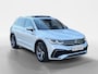 Volkswagen Tiguan 1.5 TSI R-Line Business+ | Automaat | Elektrisch uitklapbare trekhaak | Glazen schuif-/kanteldak | Elektrisch bedienbare achterklep | Stoel- en stuurverwarming | Achteruitrijcamera | Head-up display