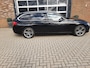 BMW 3-Serie Touring 320i Lease Executive Panorama Ned auto