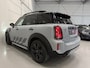 MINI Countryman 2.0 Cooper SE ALL4 Untamed PANO/H&K/HEAD-UP/CAMERA/18"BLACK/MEMORY/SFEER/UNION-FLAG A.LICHTEN/UNIEKE AUTO, ALLE EXTERIEUR ACCENTEN BLACK ALL BLACK INCL. BELTLINE EN VELGEN BLACK/MOMENTUM-GREY