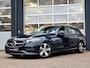 Mercedes-Benz C-klasse Estate 200 Launch Edition Luxury Line | Trekhaak | Rijassistentiepakket | Achteruitrijcamera | Sfeerverlichting | Stoelverwarming | Dodehoekassistentie | Elektrische achterklep