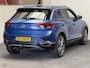 Volkswagen T-Roc 1.5 TSI SPORT AUTOMAAT NAVIGATIE ADAPTIVE CRUISE CONTROL APPLE CARPLAY/ANDROID RIJSTROOKSENSOREN ACHTERUITRIJCAMERA NIEUWE ALL SEASONS BANDEN AFN. TREKHAAK ZEER MOOI !! Brgl