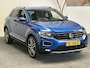 Volkswagen T-Roc 1.5 TSI SPORT AUTOMAAT NAVIGATIE ADAPTIVE CRUISE CONTROL APPLE CARPLAY/ANDROID RIJSTROOKSENSOREN ACHTERUITRIJCAMERA NIEUWE ALL SEASONS BANDEN AFN. TREKHAAK ZEER MOOI !! Brgl