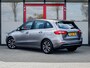 Mercedes-Benz B-klasse 180 Business Solution | Origineel NL | 2e Eigenaar | Navigatie | Camera | Climate Control | Cruise Control | Wide Screen | All Season Banden | 16'' Lichtmetalen Velgen | Metallic Lak | Dimlichten Automatisch |