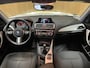 BMW 1-Serie 116i High Executive|M-STUUR|BLACK-WHITE EDITION|STOELVERWARMING|NAVIGATIE|AIRCO|CRUISE CONTROL|PDC V+A|LMV BLACK|MARGE