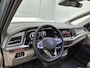 Volkswagen Multivan 1.5 eHybrid L2 Bulli Edition 4Motion 245PK | Automaat | Trekhaak | Elektrische Schuifdeuren | Elektrische Achterklep | Achteruirijcamera | Verwarmbare Voorstoelen | Verwarmbare Voorruit | Trekhaak | 7-Zits Vis-a-Vis | Multifunctioneel Stuurwiel | Verschuifbare Tafel | Adaptive Cruise Controle | Navigatie | IQ.Light | Glazen Panorama Dak |