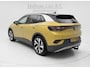 Volkswagen ID.4 First 77 kWh 204pk | Trekhaak | Camera | Warmtepomp | SOH 89,87% | Honey Yellow Metallic