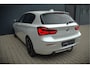 BMW 1-Serie 118i Sport Line Edition | Stoelverwarming | Cruise Control | Parkeersensoren | Navigatie | Groot Scherm | Digitale Tellers | Automaat | Keyless | Trekhaak | LED