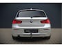 BMW 1-Serie 118i Sport Line Edition | Stoelverwarming | Cruise Control | Parkeersensoren | Navigatie | Groot Scherm | Digitale Tellers | Automaat | Keyless | Trekhaak | LED