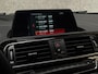 BMW 1-Serie 118i Sport Line Automaat (VIRTUAL COCKPIT, NAVIGATIE, ZWART HEMEL, CLIMATE, PARKEERSENSOREN, SPORTSTOELEN, CRUISE, NIEUWE APK, NIEUWSTAAT)