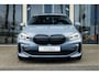 BMW 1-Serie 118i Aut. 141PK | High Executive | M-Sportpakket | 2e Paasdag OPEN OP AFSPRAAK! | Panoramadak | Lederen Kuipstoelen | M135i SS Sportuitlaat | 19" LM Velgen | M-Sport Remsysteem | Achteruitrijcamera | HIFI |