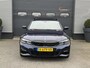 BMW 3-Serie Touring 320i High Executive M-Sport | Panoramadak | Camera | Head-Up Display | DAB |