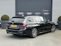 BMW 3-Serie Touring 320i High Executive M-Sport | Panoramadak | Camera | Head-Up Display | DAB | Stoelverwarming | Elektrische Achterklep |