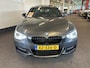 BMW 1-Serie M135i xDrive High Executive 6 Cilinder | Panoramadak | Harman/Kardon | Lederen bekleding | Memory seats | Achteruitrijcamera | M Sport stuur | Adaptief onderstel | Cruise control | Climate control | Stoelverwarming