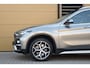 BMW X1 sDrive20i Orange Edition II * Sportstoelen * Panoramadak * Head-up * Trekhaak *