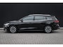 Ford Focus Wagon 1.0 EcoBoost Hybrid Titanium | Adaptieve cruise | Dodehoek detectie | Head-up display | LED verlichting | AGR-stoel | Winter-pack | Parkeer-camera | Nieuw model | Keeless | Elec. achterklep