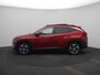 Hyundai Tucson 1.6 T-GDI PHEV Premium Sky 4WD | 360 graden camera | Stoelverwarming en stoelverkoeling | Schuif/ kantel dak | Draadloze telefoon oplader |