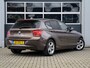 BMW 1-Serie 114i Upgrade Edition | Leder | Schuifdak | Xenon | Sportstoelen | PDC