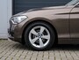 BMW 1-Serie 114i Upgrade Edition | Leder | Schuifdak | Xenon | Sportstoelen | PDC