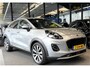 Ford Puma 125 Pk Titanium X Benzine * Navigatie * Adaptive Cruise Control * Achteruitrij Camera * 18" L.M. Velgen * Vingerhoets; Vierde Generatie Eersteklas Service. Al meer dan 100 jaar een begrip in de Brabantse Kempen.