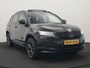 Skoda Karoq 1.5 TSI ACT Sportline 150pk DSG Dealer O.H | Trekhaak Afn. | Panodak | RS Sportstoelen Verwarmd | Adaptive Cruise | Sfeerverlichting | Camera | Apple Carplay | Keyless | Navigatie | DAB | 19" L.M |