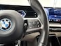 BMW iX1 eDrive20 67 kWh M-Pakket | SOH 98% | Panormadak | Sportstoelen | Curved Display | Harman/Kardon | Camera | Apple CarPlay/Android Auto | Ele.verstelbare stoelen + Geheugen | Ele. kofferdeksel |